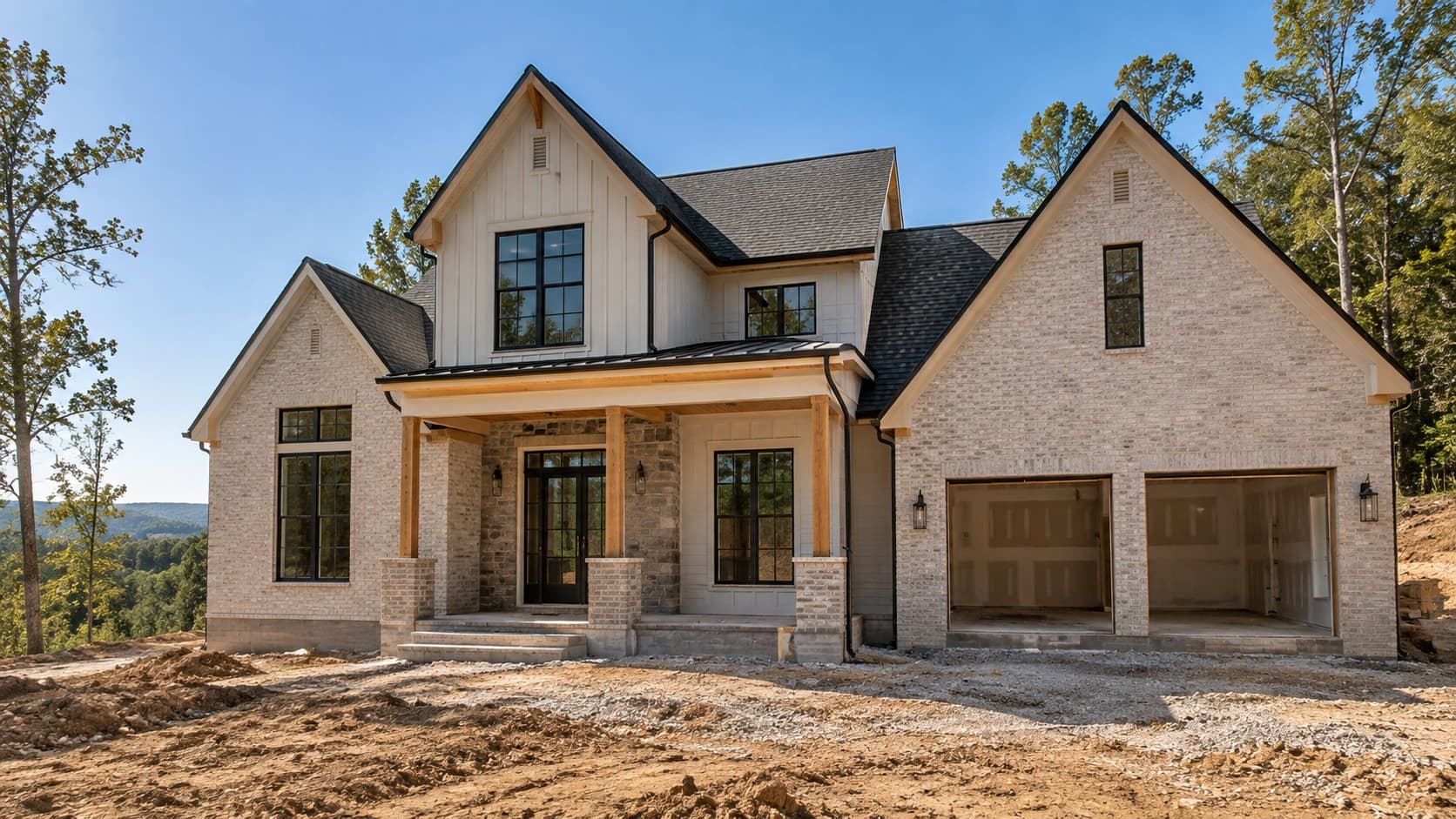 A newly built home nearing completion, seen from the front on a bright day