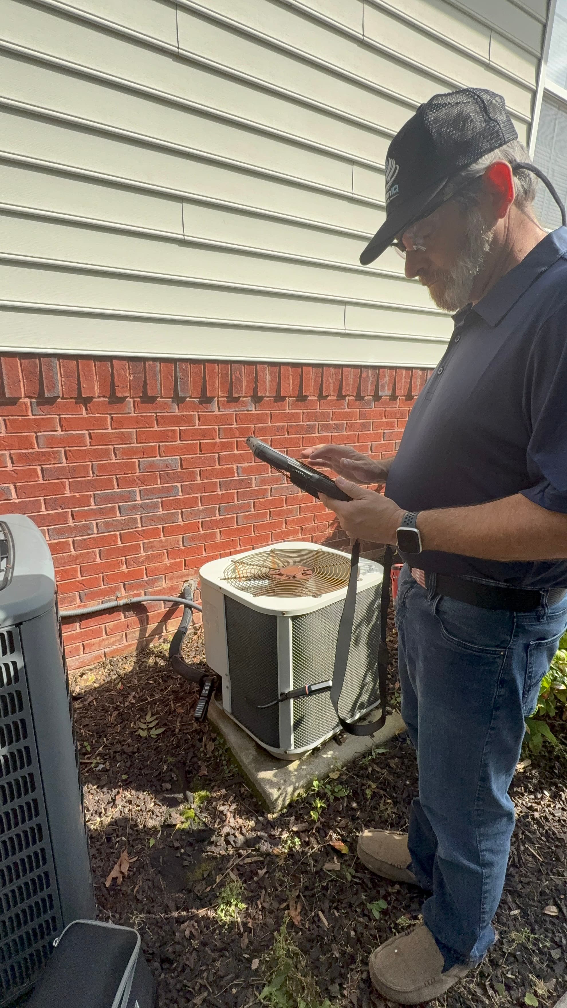 Russell recording system readings on a tablet at an outdoor condenser